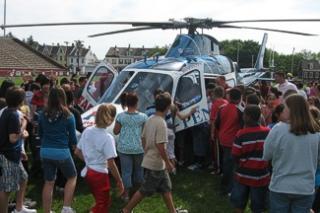 Kids Surrounding a Helicopter